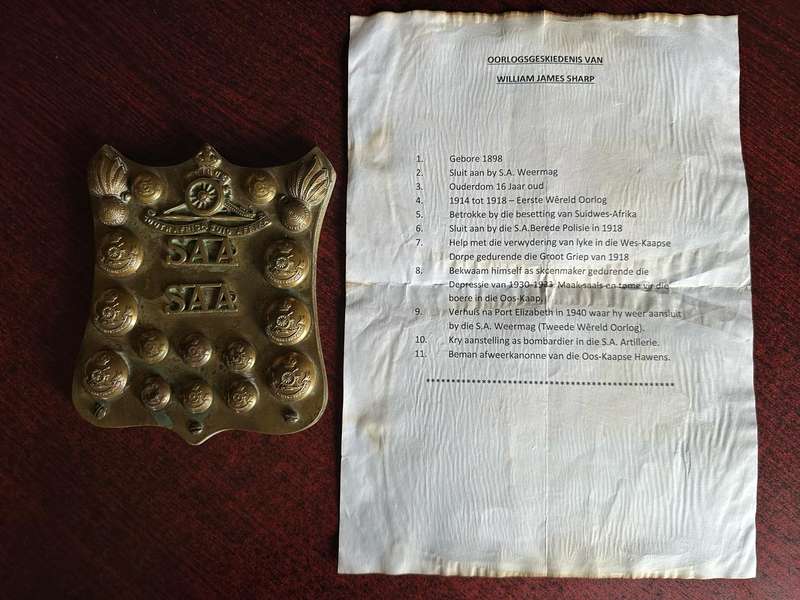 SA ARTILLERY BADGE,TITLES AND BUTTONS MOUNTED ON COPPER-MADE INTO A PLAQUE WITH A LETTER FROM THE FA