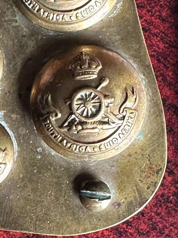 SA ARTILLERY BADGE,TITLES AND BUTTONS MOUNTED ON COPPER-MADE INTO A PLAQUE WITH A LETTER FROM THE FA