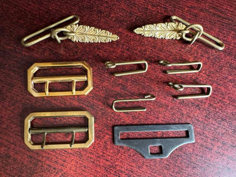 SELECTION OF BELT BUCKLES AND HANGERS-SOLD TOGETHER
