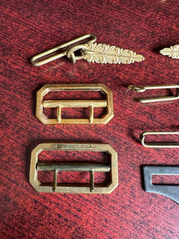 SELECTION OF BELT BUCKLES AND HANGERS-SOLD TOGETHER