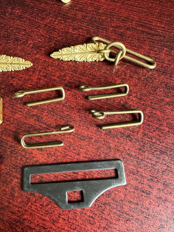 SELECTION OF BELT BUCKLES AND HANGERS-SOLD TOGETHER