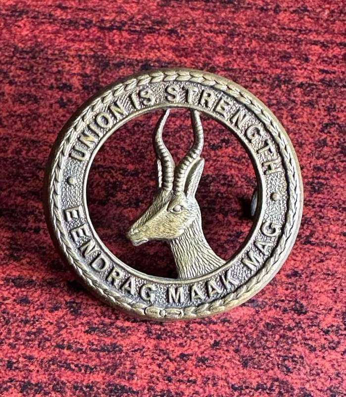 SA GENERAL SERVICES CORPS CAP BADGE (BRASS) 2 LUGS-WORN WW2