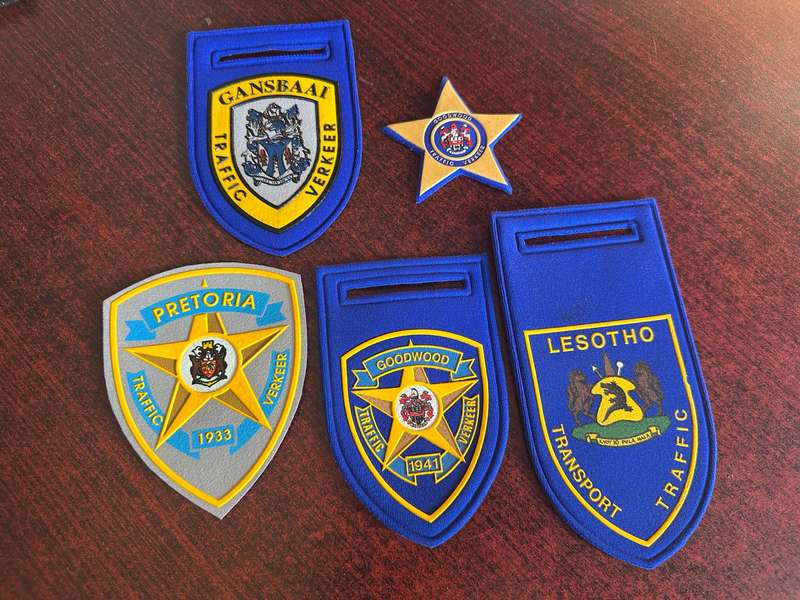 SELECTION OF TRAFFIC FLASHES AND BADGE- 5 IN TOTAL