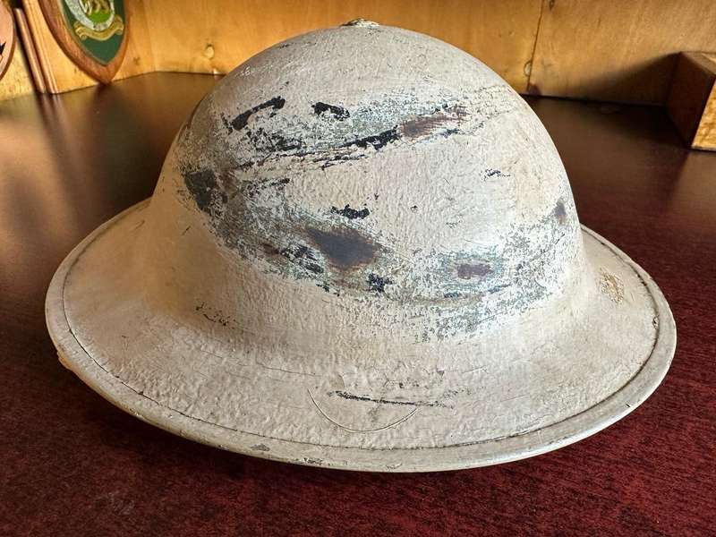 WW2 SA BRODIE HELMET-USED IN NORTH AFRICA-3 HOLES IN THE BACK FOR NECK FLAP-PAINTED DESERT CAMO-GOOD