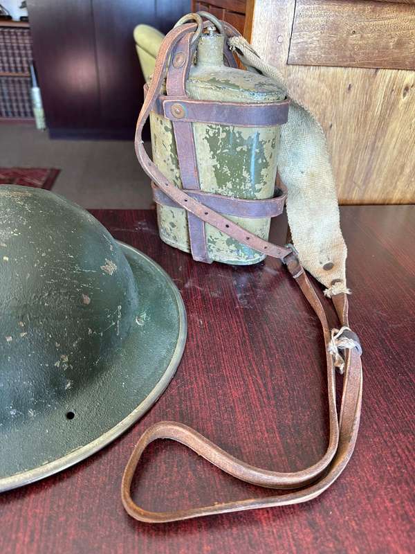 BRITISH WW2 MARK 2 STEEL HELMET WITH WW2 WATER BOTTLE-THE BOTTLE IS COMPLETE WITH STOPPER AND LEATHE