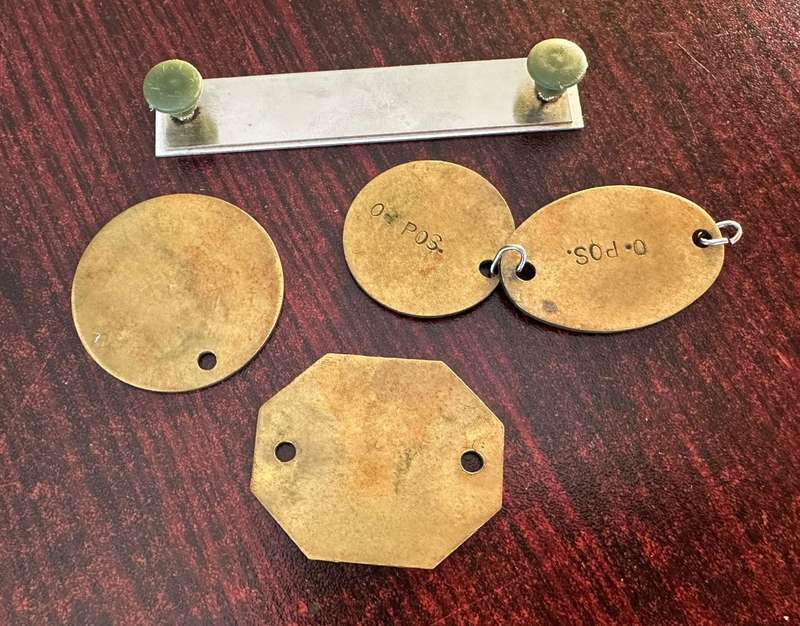 Dog tags and name plate for col. Radmore, border war period