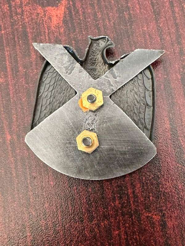 Danie Theron Combat School, blackened Cap badge. 2x screw lugs.