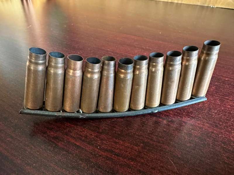 AK 47 Stripper clip. 11 Empty rounds