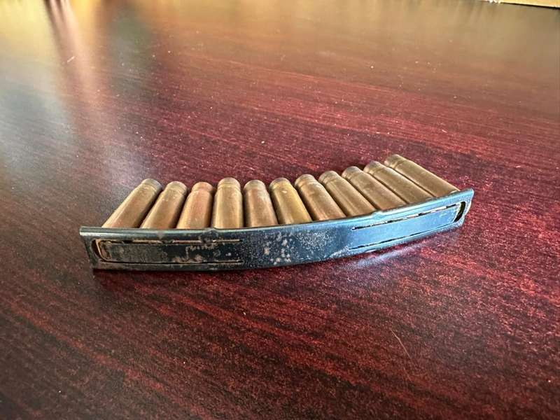 AK 47 Stripper clip. 11 Empty rounds