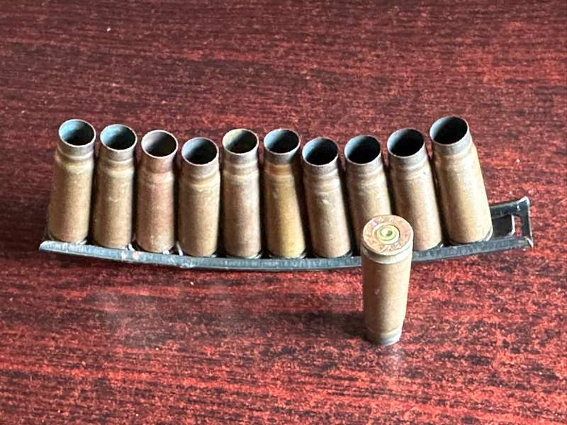 AK 47 Stripper clip. 11 Empty rounds
