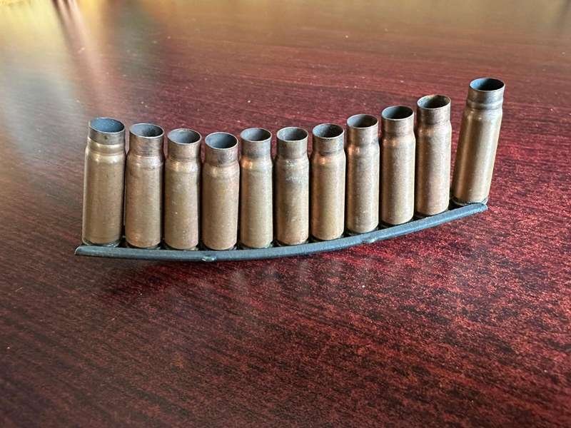 AK 47 Stripper clip. 11 Empty rounds