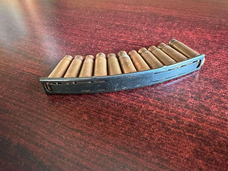 AK 47 Stripper clip. 11 Empty rounds