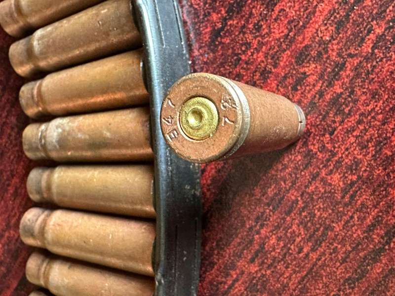 AK 47 Stripper clip. 11 Empty rounds