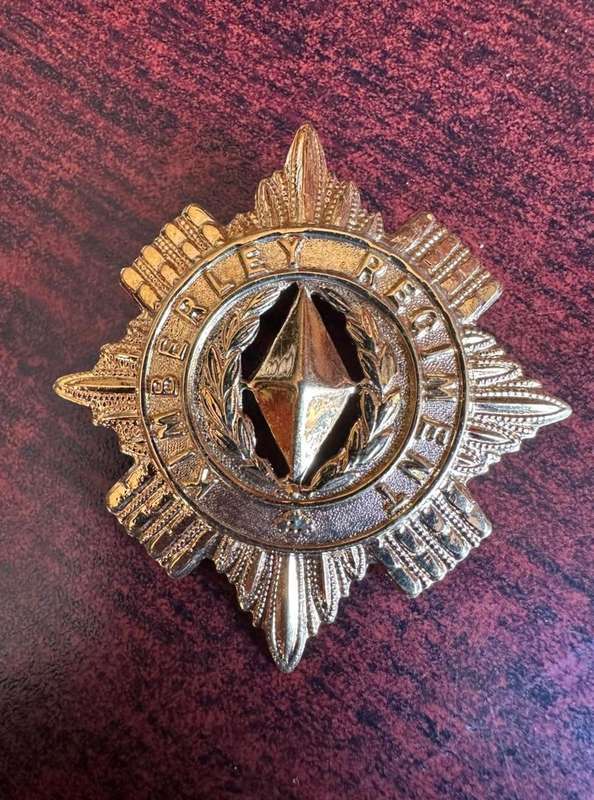 Kimberley Regiment ,gilt officers cap badge,worn post 1906. 2 Lugs. Voided centre.