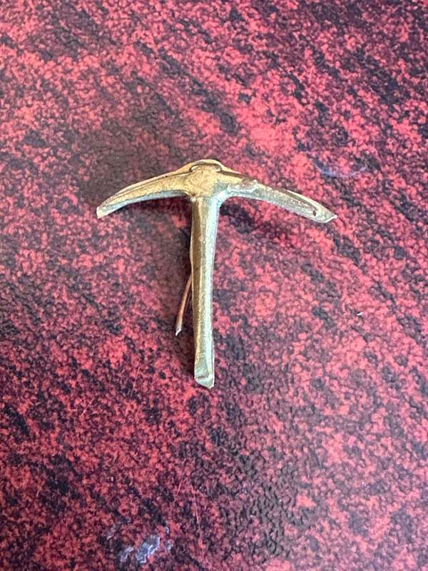 Rhodesian brass pick emblem,denotes an act of bravery,distinguished service, or continuous devotion