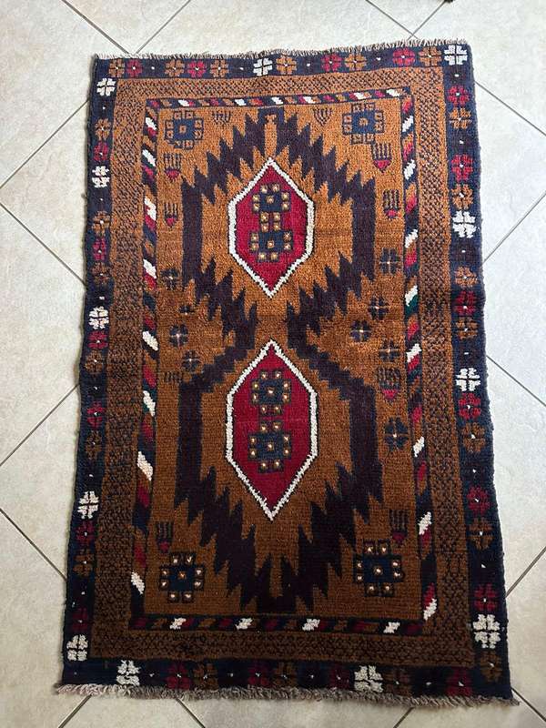 Authentic Balouchi handmade Persian carpet. Measures 1410 X 860 mm. Condition unused