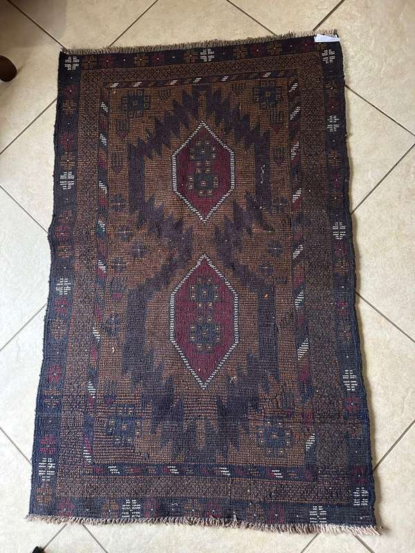 Authentic Balouchi handmade Persian carpet. Measures 1410 X 860 mm. Condition unused