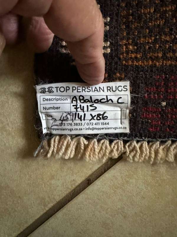 Authentic Balouchi handmade Persian carpet. Measures 1410 X 860 mm. Condition unused