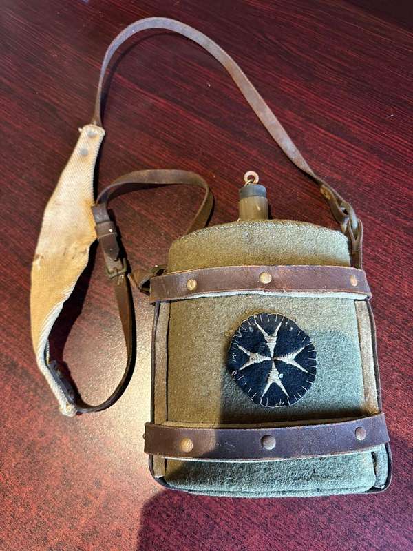 WW2 water bottle,with St John,s (medics) patch,stitched onto the cover. The bottle is in complete an