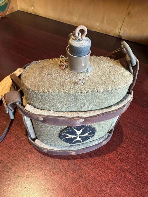 WW2 water bottle,with St John,s (medics) patch,stitched onto the cover. The bottle is in complete an