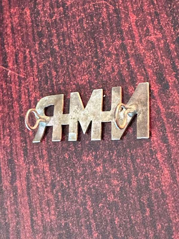 Natal Mounted Rifles. Sheet metal title. 2 Lugs. white metal.