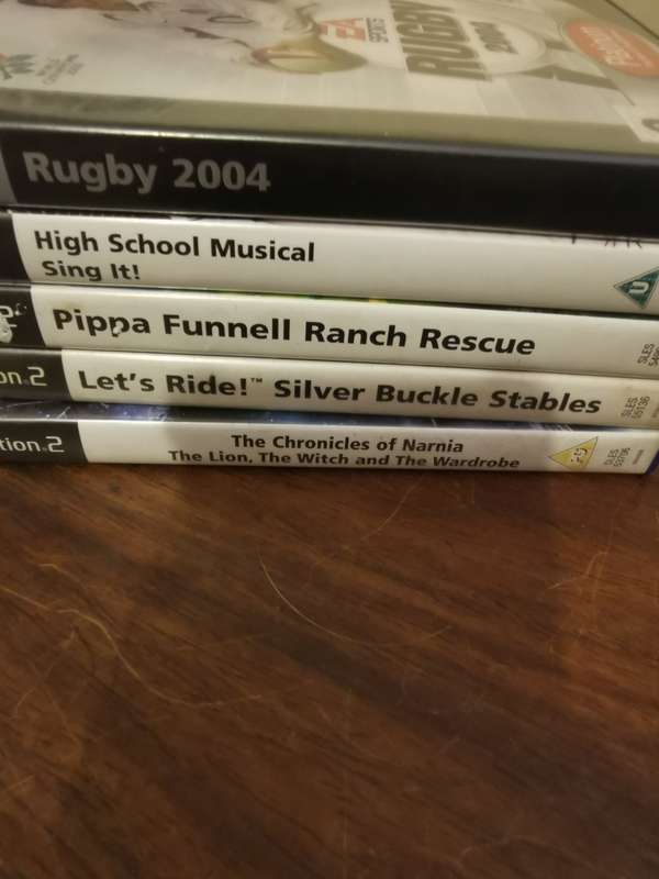 Massive Collection of PlayStation 2 Games with a Memory Card and Original Remote