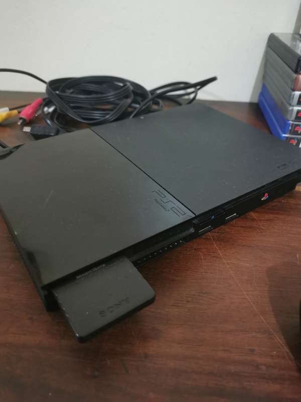 PlayStation 2 Console with Memory Card, Controllers and 7 Games