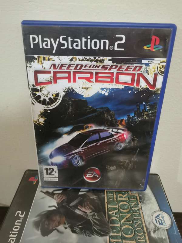 PlayStation 2 Console with Memory Card, Controllers and 7 Games
