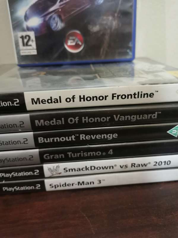 PlayStation 2 Console with Memory Card, Controllers and 7 Games