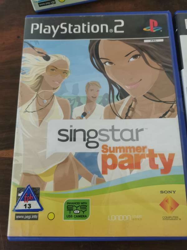 Singstar Game Collection on PlayStation 2 with an Extra Microphone