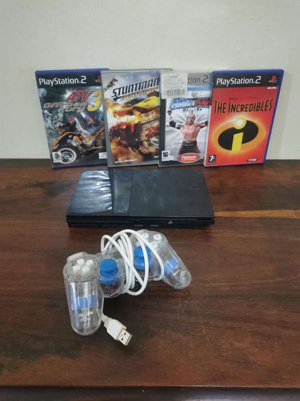 PlayStation 2 Console with Generic Remote and Games