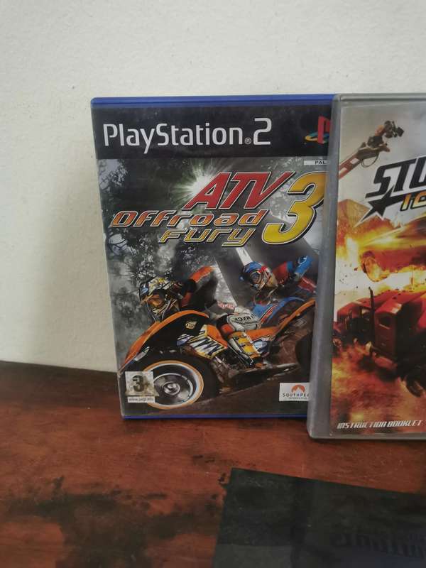 PlayStation 2 Console with Generic Remote and Games