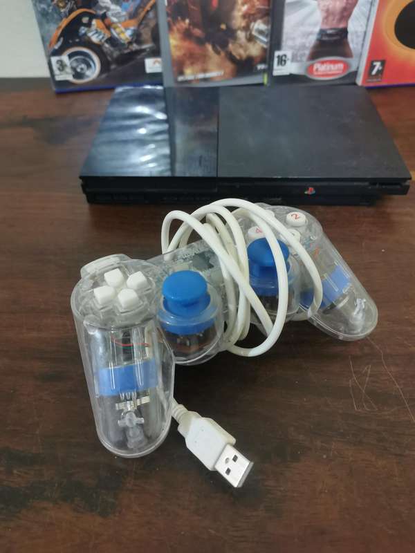 PlayStation 2 Console with Generic Remote and Games