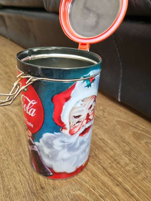 Coca Cola branded gift tin and rugby scarf.