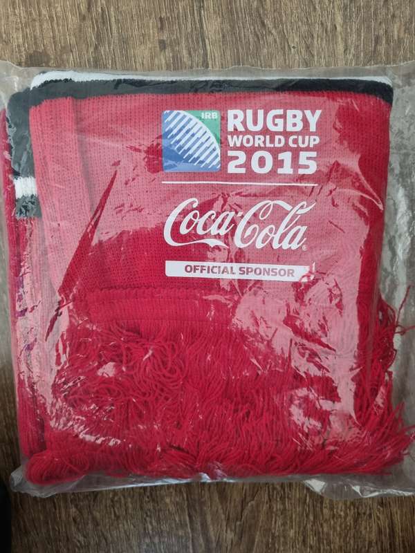 Coca Cola branded gift tin and rugby scarf.