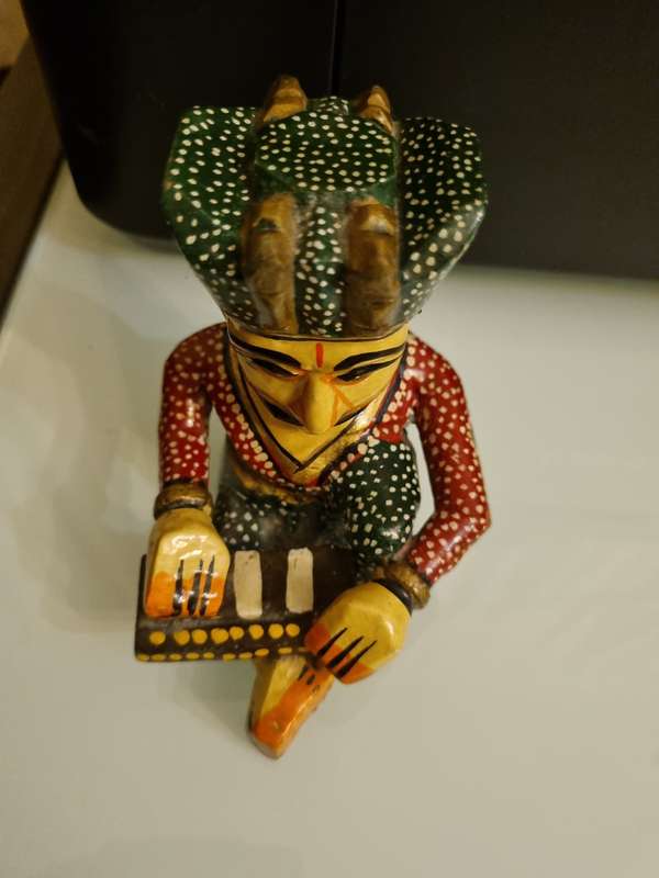 Wooden Statuette - Man playing instrument & Beaded necklace.