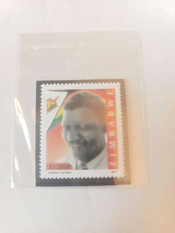 Collectors Zimbabwe five thousand dollars travels cheques and a stamp