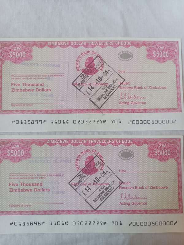 Collectors Zimbabwe five thousand dollars travels cheques and a stamp