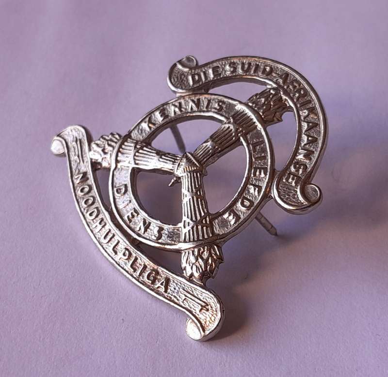 SA Noodhulp Liga Cap Badge.  Pins Intact.