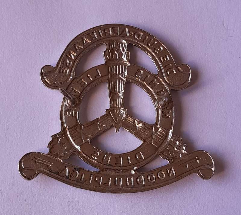 SA Noodhulp Liga Cap Badge.  Pins Intact.