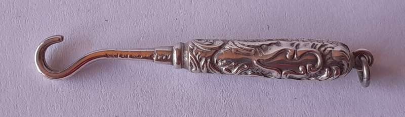 Edwardian All Solid Silver Miniature Glove Hook Pendant. Adie & Lovekin, Birmingham.