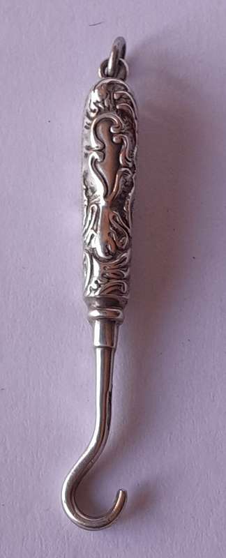 Edwardian All Solid Silver Miniature Glove Hook Pendant. Adie & Lovekin, Birmingham.