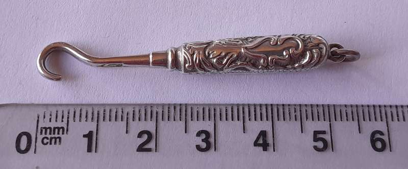 Edwardian All Solid Silver Miniature Glove Hook Pendant. Adie & Lovekin, Birmingham.
