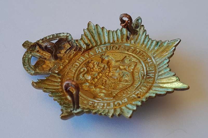 Early SA Police Union of South Africa Helmet Badge.  Lugs Intact.  Excellent Condition.