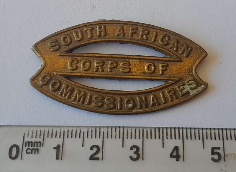 Rare SA Corps of Commissionaires Cap Badge.  No Lugs.