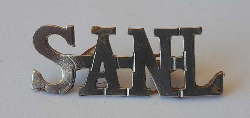 Early South African Nursing League Shoulder Title.  Bent Lugs.