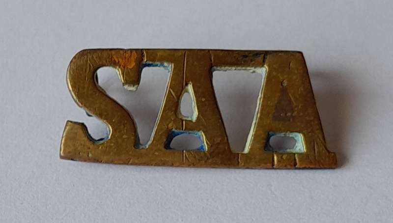 WW2 SA Artillery Regiment Brass Shoulder Title.  Lugs Intact.