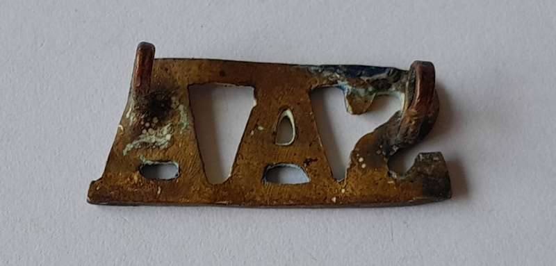 WW2 SA Artillery Regiment Brass Shoulder Title.  Lugs Intact.