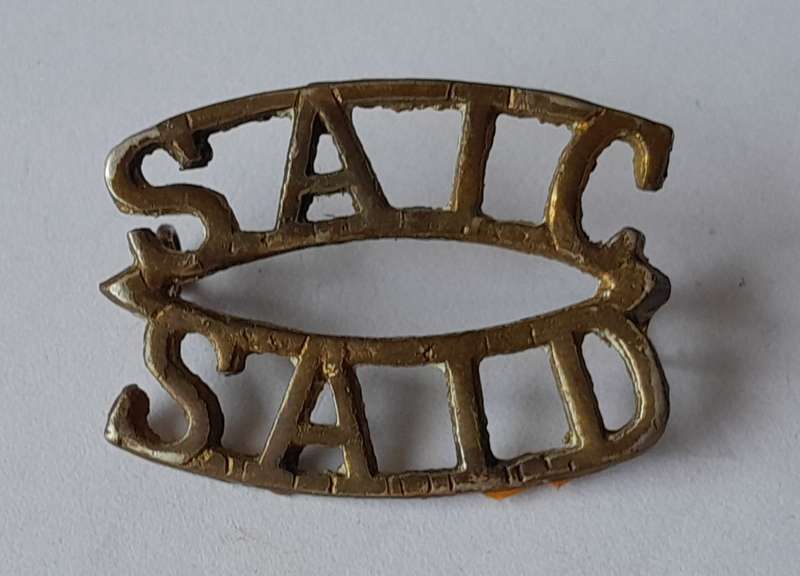 Early SA Army Instructional Corp Brass Shoulder Title.  Lugs Intact.