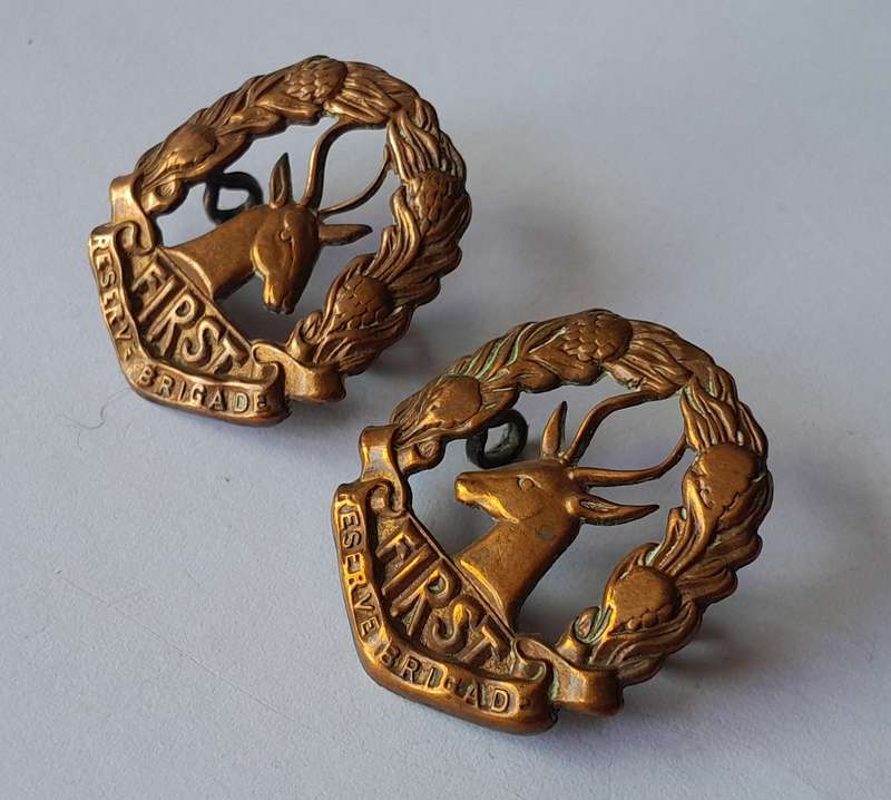 Pair WW2 SA Army First Reserve Brigade Collar Badges.  Lugs Intact.